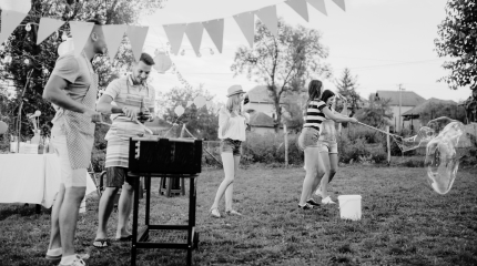 People in the garden , having fun and cooking during summer