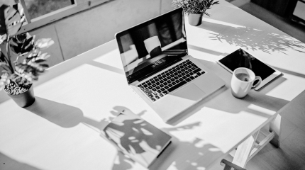 laptop and ipad on a table in a home