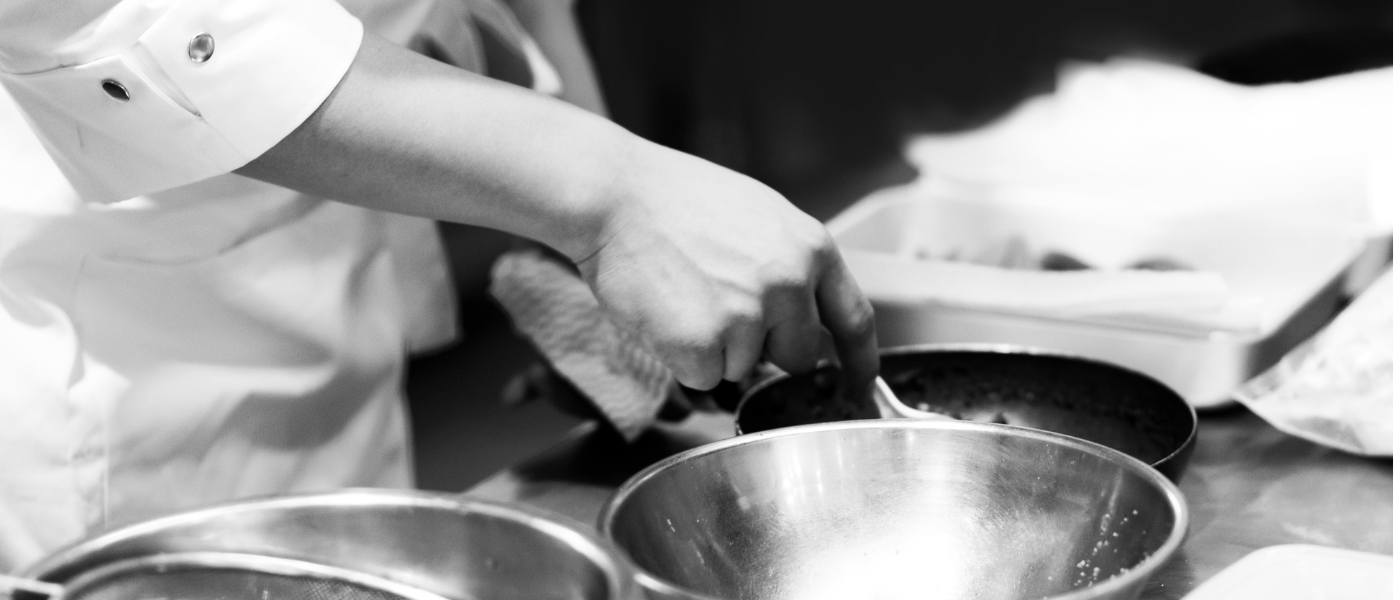 black and white photo - chef cooking 