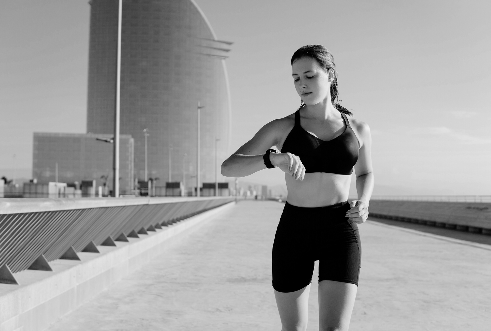 A woman looking at her smart watch ()