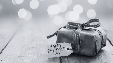 fathers day gift with a tag resting on a table
